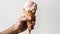 A Handful of Happiness, A Mans Hand Holding a Delicious Scoop of Milk Ice Cream on a Crispy Waffle Cone. Generative AI