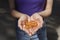 A handful of vitamin d capsules are in women`s hands. Blurred background