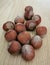 A handful of whole hazelnuts.