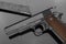 Handgun on dark background with ammo clip
