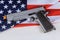 Handgun pistol on American flag crime and punishment