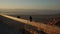 Handheld: Birds rest on a railing overlooking the Dead Sea