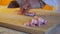 Handheld slow motion shot of pork belly getting cut on a bamboo cutting board