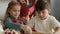 Handheld video of children making gingerbread pastry.