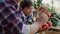 Handheld video of grandfather and grandson watching harvested vegetables.