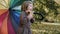 Handheld view of happy girl with umbrella in the fall season