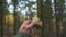 Handheld View of Picking a Pine Bolete in Autumn Forest