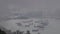 Handheld view of ships anchored in Victoria Harbor on rainy cloudy day