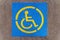 Handicap parking sign on asphalt, persons with disabilities