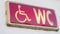 Handicap restroom illuminated sign