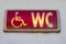 Handicap restroom illuminated sign