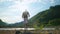 Handicapped backpacker with prosthetic leg admiring mountain landscape