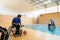 a handicapped basketball player prepares for a match while sitting in a wheelchair.preparations for a professional