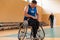 a handicapped basketball player prepares for a match while sitting in a wheelchair.preparations for a professional