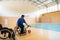 a handicapped basketball player prepares for a match while sitting in a wheelchair.preparations for a professional