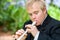 Handicapped boy playing block flute.