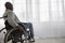 Handicapped man sit in wheelchair in hospital or home, mature disabled in invalid carriage or wheel chair