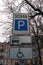 Handicapped parking sign for disabled driver. Text on sign: Parking zone. Car parking sign. Rules and regulations.