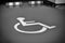 Handicapped parking sign on the floor. selective focus. black and white background. handicapped area. reserved parking