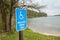 Handicapped parking sign by a pretty lake