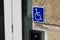 Handicapped sign logo on wall entrance store access pictogram on street shop