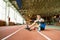 Handicapped Sportsman Sitting on Running Track