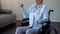 Handicapped woman lifting dumbbells, rehabilitation after car accident, hospital