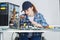 Handicapped young woman assembling motherboard