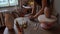 Handicraft pottery making: hands of female ceramist work with clay on table in ceramics studio