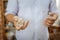 Handicraftsman having handful of earthenware for his handiwork