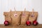 Handmade advent calendar with paper bags and clothes peg.