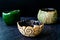 Handmade Assorted Many Different Bright Multicolored Ceramic Bowls and Cups Handcrafted / Assortment Variety on Dark Surface and