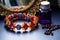 handmade beaded bracelet on a dressing table with makeup brushes