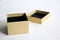A handmade beige pasteboard box on a white textural background