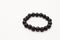 Handmade black onix bracelet on a white background