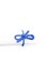 Handmade blue string knot tied on white letter roll isolated