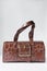 Handmade brown embossed calfskin leather handbag