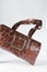 Handmade brown embossed calfskin leather handbag