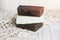 Handmade brown lye and olive white soap bars, healing feminine concept. Eco organic coal tar and olive soap pieces on the rustic