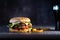 Handmade burger with fries and on dark background