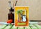 A handmade card with stamped penguin and a palm tree in yellow and orange colors