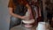 Handmade ceramics art. Process of shaping pottery vase in studio with focused young female at work