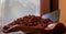 Handmade chocolates beautifully presented in wooden vessels at the Dark Sugars shop in Brick Lane, London, UK.