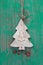 Handmade christmas decoration - tree carved on a green background