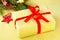 Handmade christmas gift box. Christmas presents golden box with red ribbon