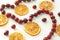 Handmade Christmas tree decoration, garland with dried orange slices and fresh cranberries. Selective f