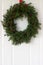 Handmade is a Christmas wreath made of spruce, thuja, juniper, boxwood and wild rose berries adorning the front door.