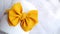 Handmade classic hair bow with golden yellow color as stylish headpiece