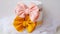 Handmade classic hair bow with peach and yellow color as stylish headpiece