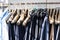 Handmade clothes hanging on a rail in a tailor